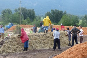 Last step is placing straw as mulch for the hugelkulture. This will protect the topsoil and seeds, most of which are broadcast Sepp Holzer style.